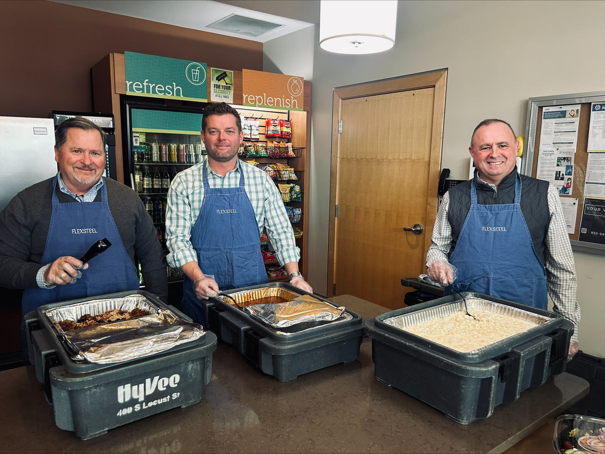 Flexsteel directors serving food to the employees